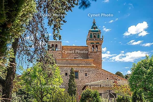 Iglesia de la Cartuja Church Tower, Valldemossa, Majorca, during sunny day with trees in front, horizontal shot, Mallorca [IBR125536407]