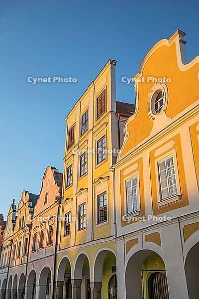 03 October 2026, Historic Renaissance facades glow in golden hour light on the main square in Telč, Czech Republic [IBR125536409]