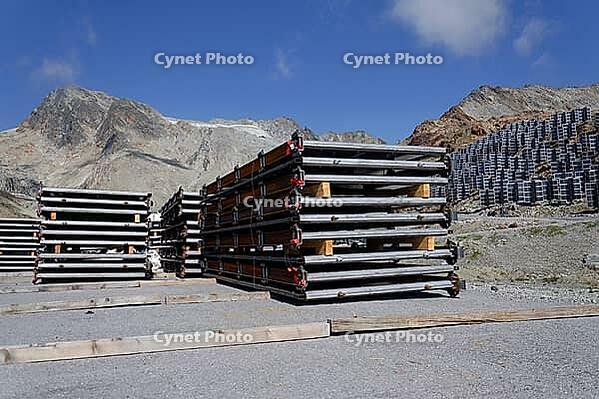 Solar panels lying on ground with vertically mounted four wings around central column, photovoltaic plant avoid snow accumulation, maintain high yields, Alps, future innovation energy concept [IBR125536411]