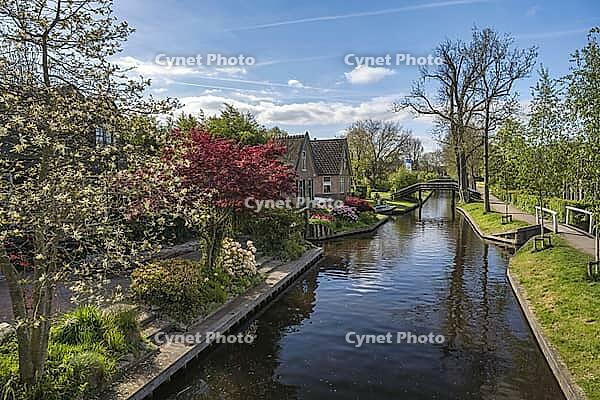 Giethoorn Netherlands, city skyline at canal and traditional house in Giethoorn village [IBR125536425]