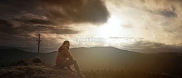 Woman in the distance on a small summit [IBR125536459]