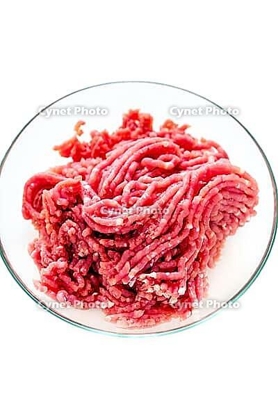 Pork mince in bowl on a white background [IBR125557581]