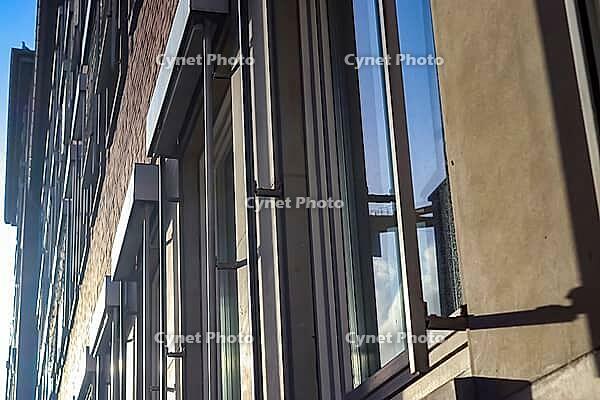 Modern office building facades with glass and reflecting sunlight in the windows found in kiel in Germany [IBR125566015]