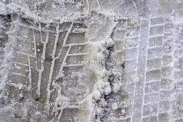 Tire tracks on snowy road.Road covered with snow, winter driving [IBR125566064]