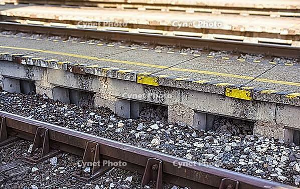 Railroad tracks near train platform, closeup detail [IBR125566072]