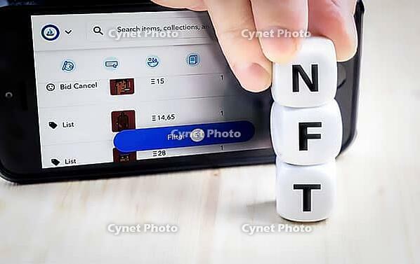 Vienna Austria June.5 2021: NFT or Non-Fungible token letters and dices, nft?s are a blockchain market for art and collections [IBR125566082]