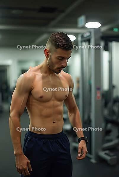 Shirtless sportsman resting after intense exercises inside a gym, AI generated [IBR125592655]