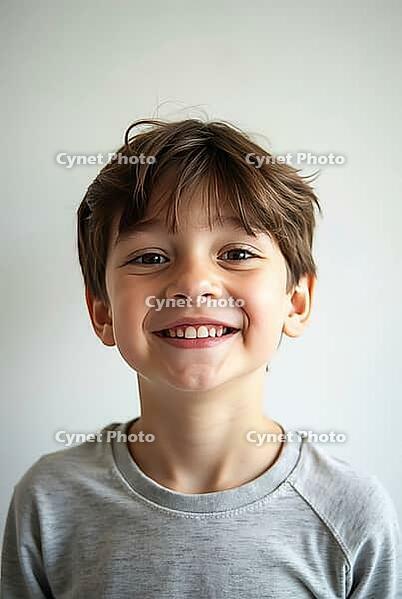 Young boy with toothy smile, showcasing Genuine Happiness and positive emotions in a simple studio setting, AI generated [IBR125592677]