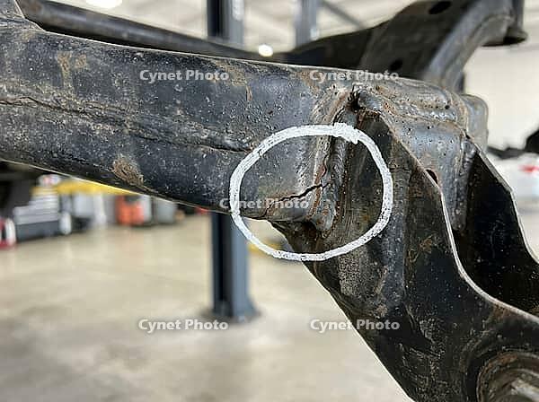 Corroded differential mounting bracket displaying a severe crack in the weld area, indicating structural failure and potential safety concerns requiring immediate inspection and repair, AI generated [IBR125592691]