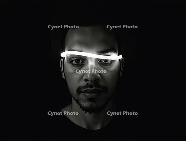 Dramatic black and white portrait of a young man with neon light illuminating his face, AI generated [IBR125592694]