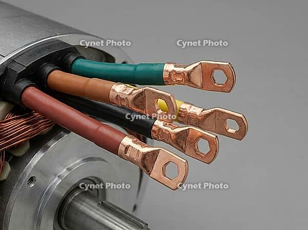 Color-coded conductors emerge from a motor stator, alongside copper lugs, exposed winding coils, and a machined shaft on a neutral gray background, AI generated [IBR125592696]