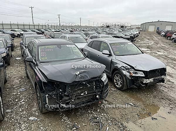 Damaged SUVs displaying significant front end collision impacts parked in a vast outdoor lot, representing the automotive salvage industry, insurance claims, and vehicle recovery operations, AI generated [IBR125592709]