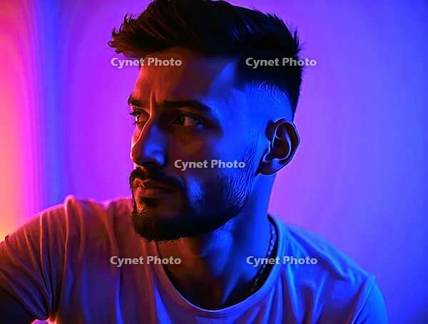 Side-lit portrait of a man in vibrant red and purple neon hüs, AI generated [IBR125592722]