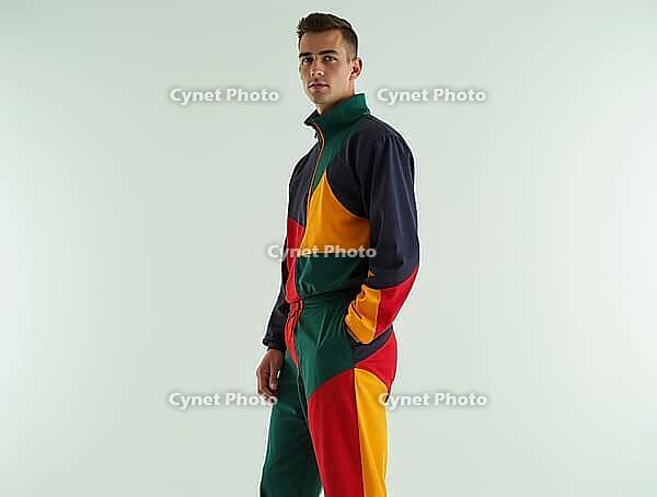 Fashionable model wearing a vibrant, geometric tracksuit, showcasing modern streetwear style, AI generated [IBR125592725]