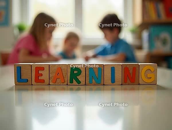 Colorful wooden blocks spelling learning on a reflective table surface with blued children in background, AI generated [IBR125592732]