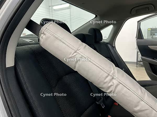 Inflatable seatbelt airbag deploying inside a modern car, demonstrating a crucial safety system designed for occupant protection during an accident or impact, providing enhanced vehicle crash safety, AI generated [IBR125592735]