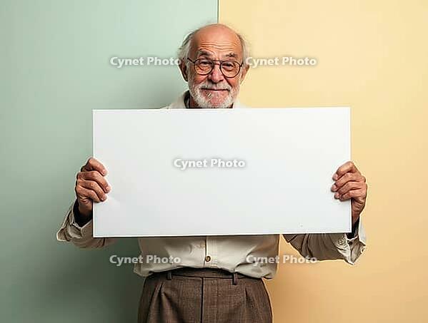 Smiling senior man holding a blank whiteboard against a pastel background, offering space for your message or design, AI generated [IBR125621279]