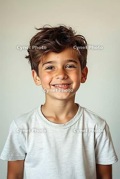 Studio portrait of a cheerful young boy with brown hair, wearing a white t-shirt, exuding happiness and confidence against a light background, AI generated [IBR125621329]