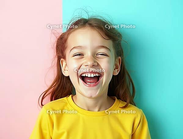 Studio portrait of a cheerful young girl laughing out loud, expressing pure joy and happiness against a vibrant two-tone pastel background, AI generated [IBR125621331]