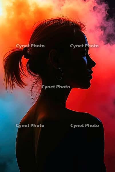 Studio portrait featuring a captivating silhouette of a young woman against a backdrop of vibrant, colorful smoke, AI generated [IBR125621343]