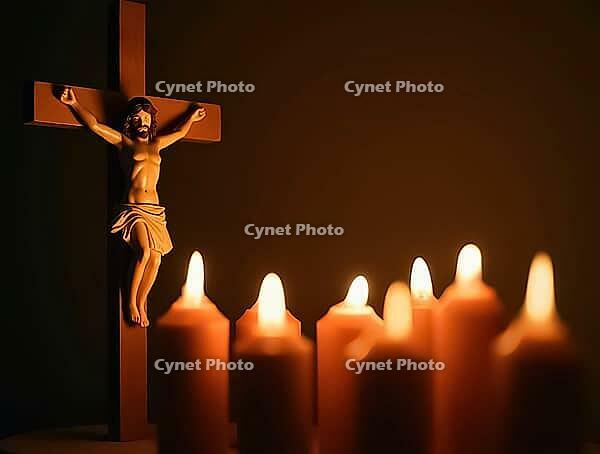 Jesus figure on a crucifix surrounded by glowing candles, AI generated [IBR125636876]