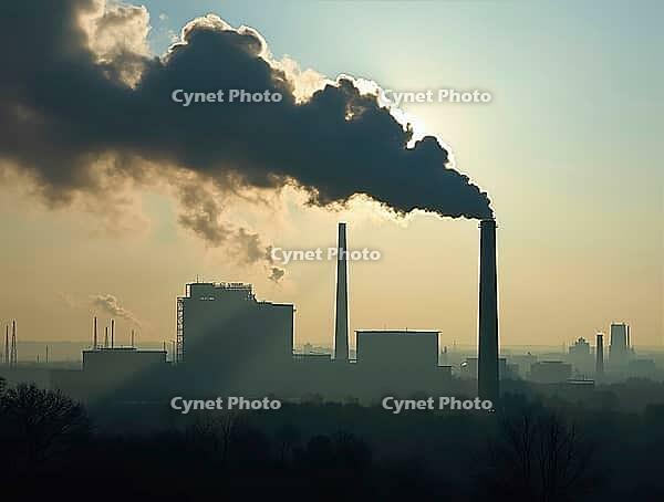Smoke billowing from industrial chimneys pollutes the atmosphere, obscuring the horizon and symbolizing environmental damage, AI generated [IBR125636905]