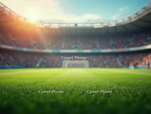 Vibrant green soccer field close-up with blurred stadium, cheering fans, and goalposts in background during sunny day, AI generated [IBR125636952]