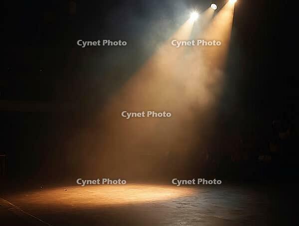 Warm spotlights illuminating an empty stage filled with smoke, creating a dramatic atmosphere, AI generated [IBR125636953]