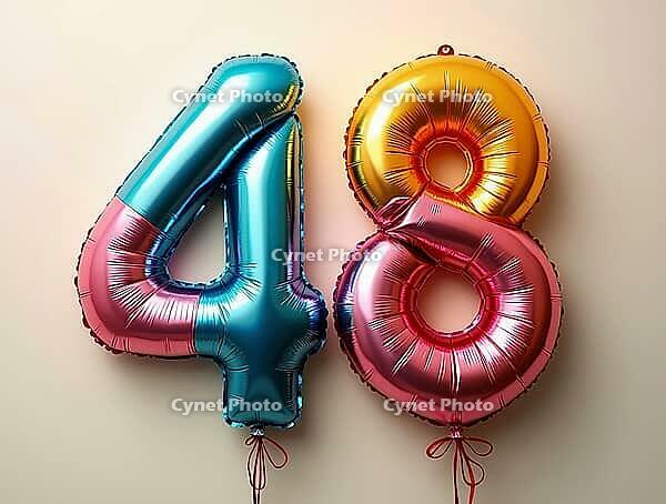 Colorful metallic balloons forming the number forty-eight floating against a light beige background, AI generated [IBR125645854]