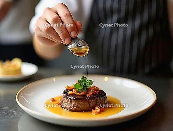 Professional chef adding finishing touch to gourmet steak dish, garnished and ready to be served, AI generated [IBR125645889]