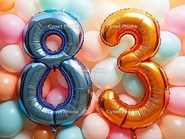 Eighty-three years celebrated with colorful balloons forming the number 83, AI generated [IBR125645924]
