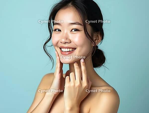 Smiling asian woman touching her face showing perfect skin for beauty products advertising campaign, AI generated [IBR125653404]