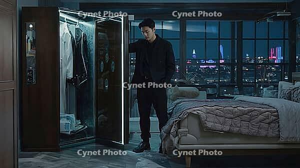 Businessman choosing clothes from futuristic smart wardrobe in his luxury penthouse bedroom with night city view, AI generated [IBR125653433]