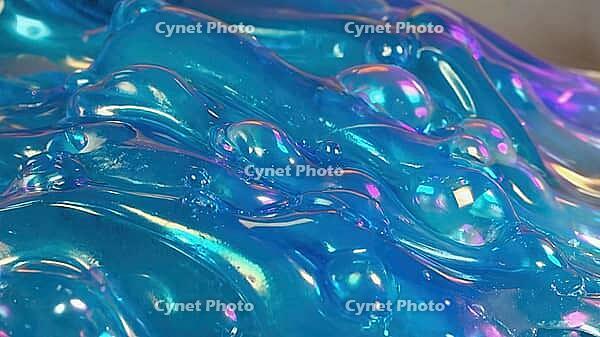 Glossy and shiny blue slime featuring playful bubbles and unique textures, creating a visually satisfying and vibrant abstract background, AI generated [IBR125653473]