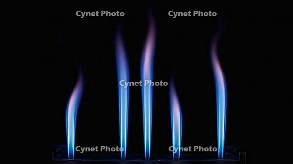 Close up of blue and purple flames rising from a burner against a dark backdrop, creating a mesmerizing visual, AI generated [IBR125653498]