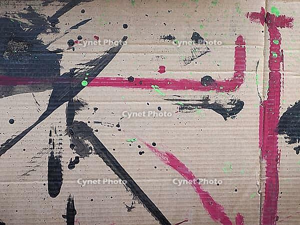 Paint stained brown corrugated cardboard useful as an industrial background [IBR125654765]