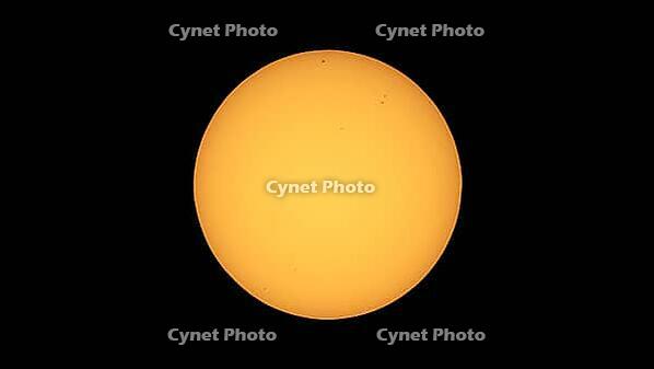 The Sun seen with telescope from planet Earth, with sunspots visible as dark spots compared to surrounding regions - 4K format [IBR125654793]