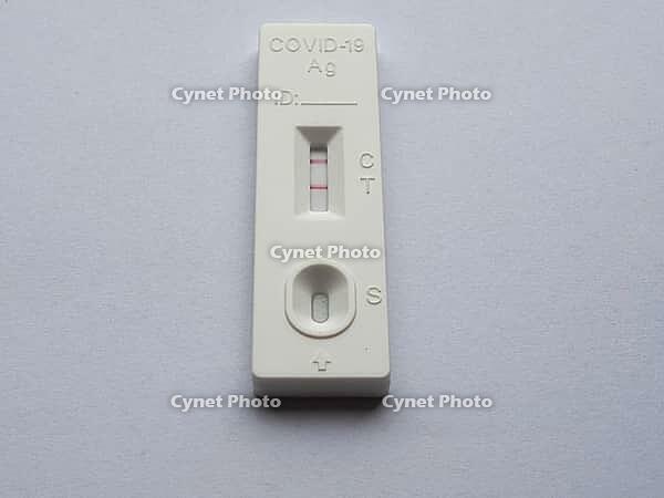 Positive Covid 19 antigen rapid test specimen well [IBR125654834]
