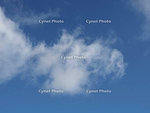Blue sky cloudscape useful as a background [IBR125654844]