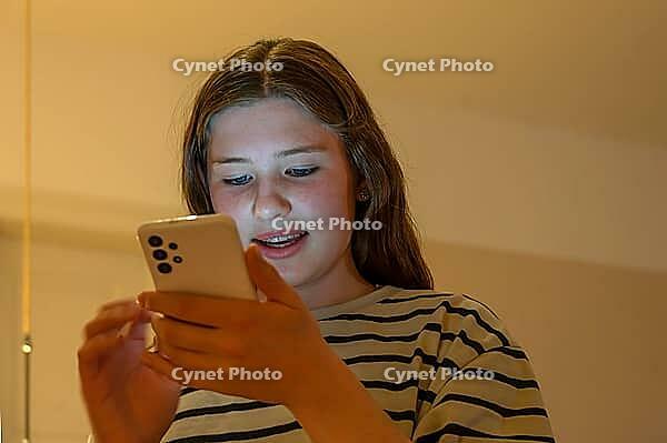 Young girl, teenager on mobile phone, Mecklenburg-Western Pomerania, Germany [IBR125657381]
