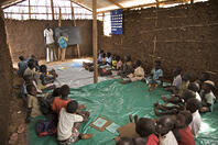 A boy learns to write numbers on a blackboard, on their first day at a BRAC Non Formal Primary School, in Manderia village, in Torid [UIG110171066]