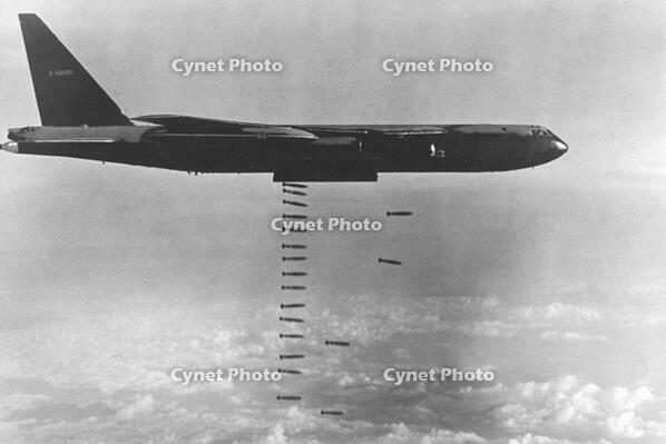 A USAF B-52D unleashes a rain of bombs siomewhere over Vietnam, c.1972. [UIG110171080]